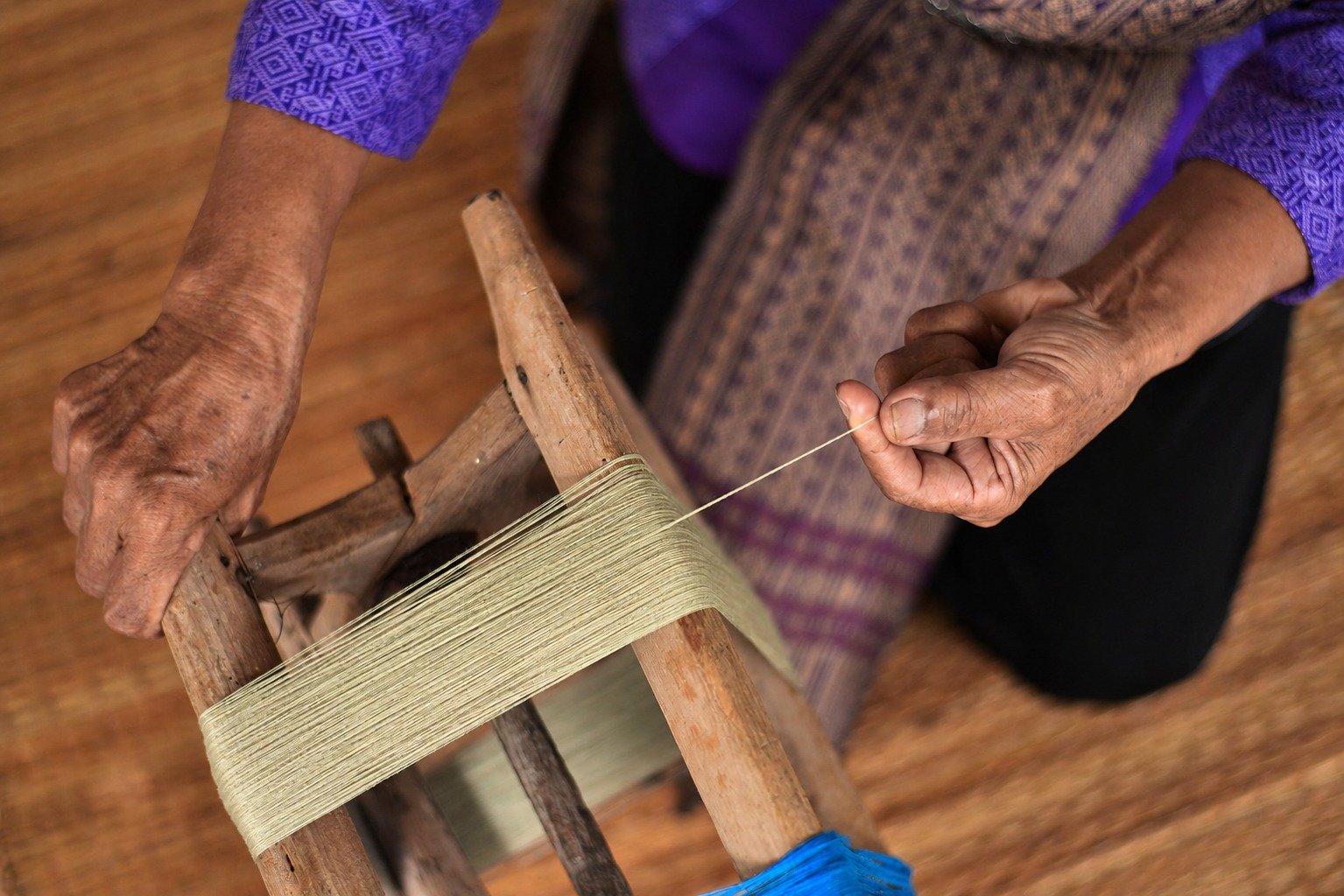 Hero visual: hand, fibre, and garment
